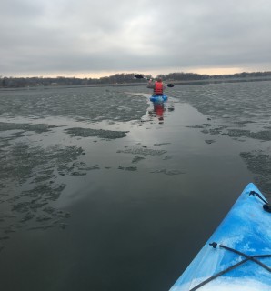 Image slide of Mike Myser kayaking on Upper Prior Lake on March 14, 2016 – the day before official lake “Ice-Out.” Photo credit: Julie Myser
